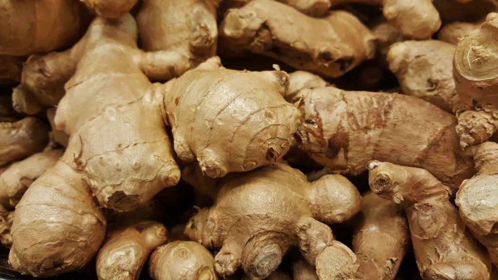 Photo of a table full of ginger root.